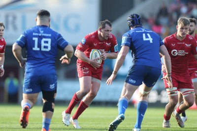 260425 - Scarlets v Leinster - United Rugby Championship - Ryan Elias of Scarlets charges at Ryan Baird of Leinster