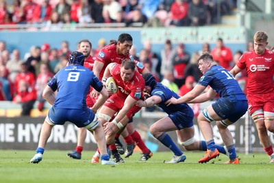 260425 - Scarlets v Leinster - United Rugby Championship - Alex Craig of Scarlets is stopped by Ryan Baird of Leinster