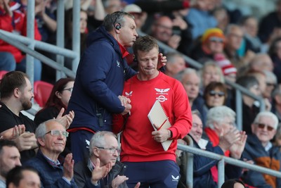 260425 - Scarlets v Leinster - United Rugby Championship - Scarlets Performance Director Leigh Jones and Head Coach Dwayne Peel at the final whistle 