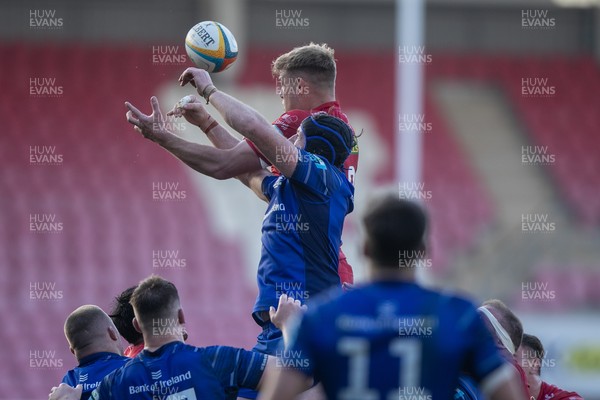 260425 - Scarlets v Leinster - United Rugby Championship - Taine Plumtree  of Scarlets wins a line out against Ryan Baird of Leinster