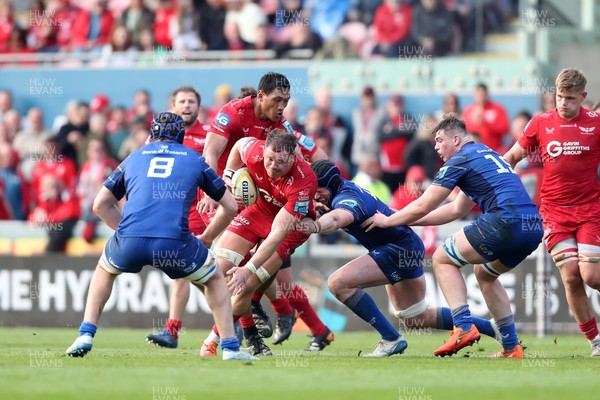260425 - Scarlets v Leinster - United Rugby Championship - Alex Craig of Scarlets is stopped by Ryan Baird of Leinster