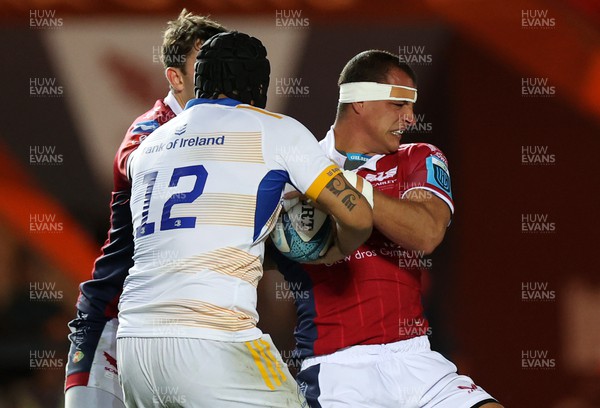 281022 - Scarlets v Leinster - BKT United Rugby Championship - Aaron Shingler of Scarlets is tackled by Charlie Ngatai of Leinster