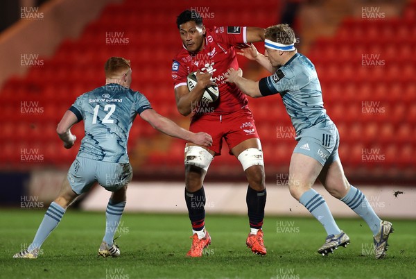 300121 - Scarlets v Leinster - Guinness PRO14 - Sam Lousi of Scarlets is tackled by Ciaran Frawley and James Tracy of Leinster