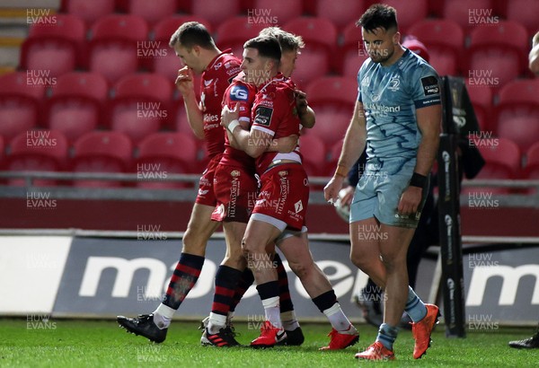 300121 - Scarlets v Leinster - Guinness PRO14 - Dane Blacker of Scarlets celebrates scoring a try with Sam Costelow