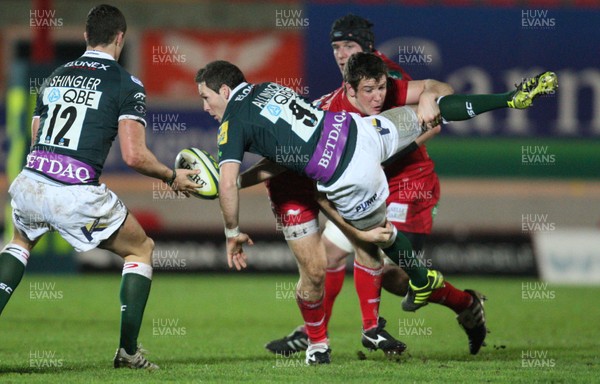 28.01.12 - Scarlets v London Irish, LV= Cup -  London Irish's Darren Allinson is tackled by Scarlets Adam Warren  