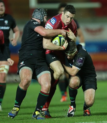 310115 - Scarlets v London Irish, LV= Cup - Scarlets Steven Shingler is tackled by London Irish's Jimmy Stevens and Darren Allinson