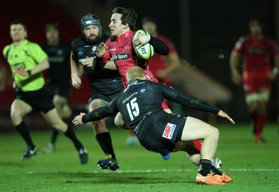 310115 - Scarlets v London Irish, LV= Cup - Scarlets Rhodri Williams races past London Irish's Tom Homer to set up a try for Adam Warren