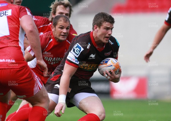 250812 Scarlets v London Welsh - Pre-season warm up -Scarlets' Dan Newton takes on the London Welsh defense