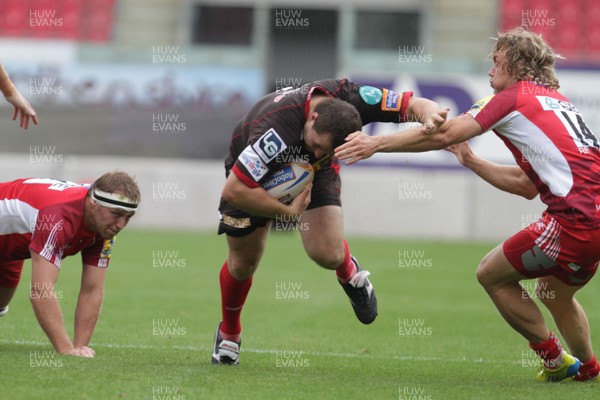 250812 - Scarlets v London Welsh - Preseason Friendly - Scarlets Ken Owens hands off Phil McKenzie of London Welsh