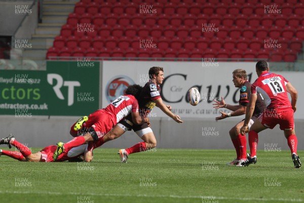 250812 - Scarlets v London Welsh - Preseason Friendly - Scarlets Adam Warren feeds Gareth Maule