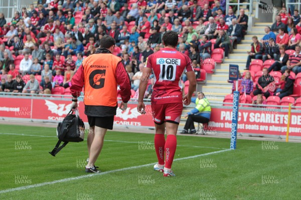 250812 - Scarlets v London Welsh - Preseason Friendly - Gavin Henson leaves the field with an injury