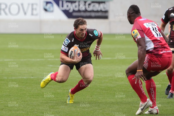 250812 - Scarlets v London Welsh - Preseason Friendly - George North runs at Joe Ajuwa of London Welsh