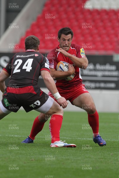 250812 - Scarlets v London Welsh - Preseason Friendly - Simon Watling takes on Dan Newton