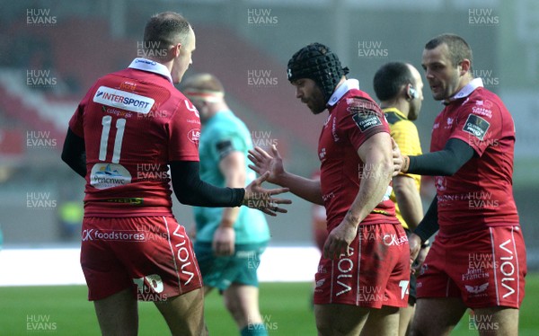 020319 - Scarlets v Munster - Guinness PRO14 - Johnny McNicholl (11) of Scarlets celebrates his try with Leigh Halfpenny