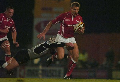 05.11.06 - Llanelli Scarlets v Munster - Magners League - Scarlets Dafydd James tries to get past Munster's Jeremy Manning 