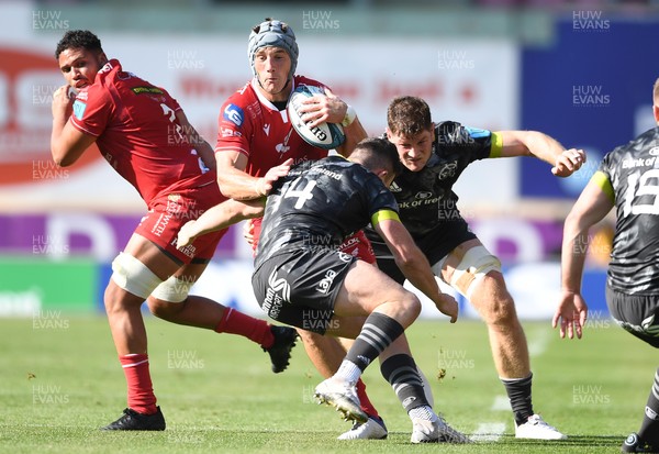 101021 - Scarlets v Munster - United Rugby Championship - Jonathan Davies of Scarlets is tackled by Calvin Nash of Munster