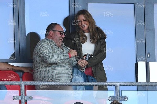 101021 - Scarlets v Munster - United Rugby Championship - Carol Vorderman watches the game with singer and actor Wynne Evans