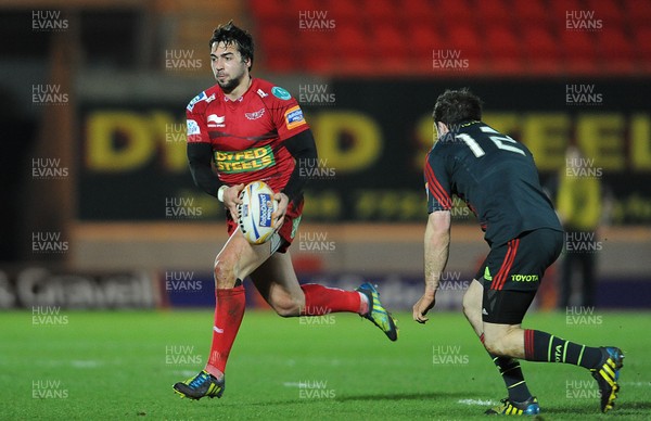 160213 - Scarlets v Munster - RaboDirect PRO12 -Gareth Owen of Scarlets takes on JJ Hanrahan of Munster