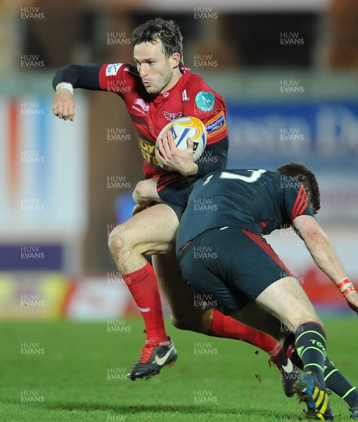 160213 - Scarlets v Munster - RaboDirect PRO12 -Andy Fenby of Scarlets takes on Ivan Dineen of Munster