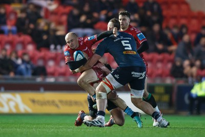 160224 - Scarlets v Munster - United Rugby Championship - Ioan Nicholas of Scarlets takes on RG Snyman of Munster