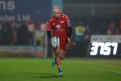 160224 - Scarlets v Munster - United Rugby Championship - Ioan Nicholas of Scarlets chips the ball