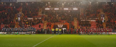 160224 - Scarlets v Munster - United Rugby Championship - Teams pay their respect to the late Barry John before the game