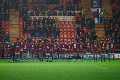 160224 - Scarlets v Munster - United Rugby Championship - Scarlets team pay their respect to the late Barry John before the game