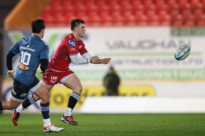 160224 - Scarlets v Munster - United Rugby Championship - Joe Roberts of Scarlets passes the ball