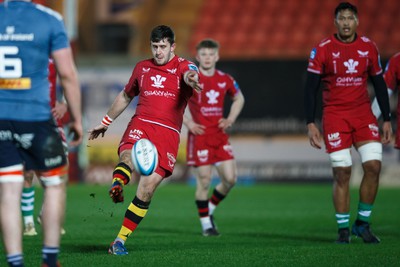 160224 - Scarlets v Munster - United Rugby Championship - Dan Jones of Scarlets kicks the ball