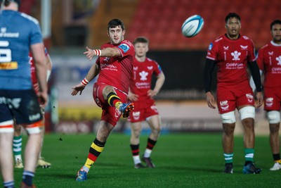 160224 - Scarlets v Munster - United Rugby Championship - Dan Jones of Scarlets kicks the ball