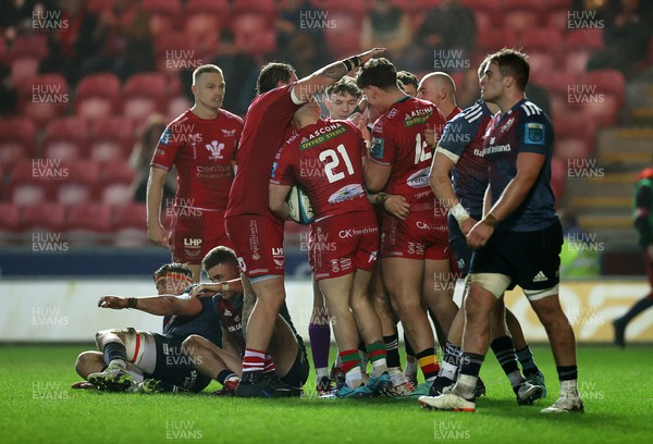 160224 - Scarlets v Munster - United Rugby Championship - Joe Roberts of Scarlets celebrates scoring a try with team mates