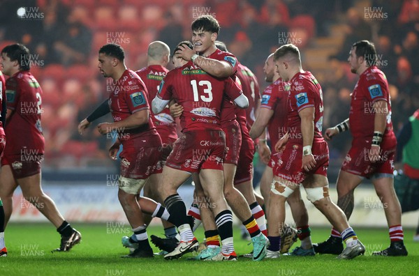 160224 - Scarlets v Munster - United Rugby Championship - Joe Roberts of Scarlets celebrates scoring a try with team mates