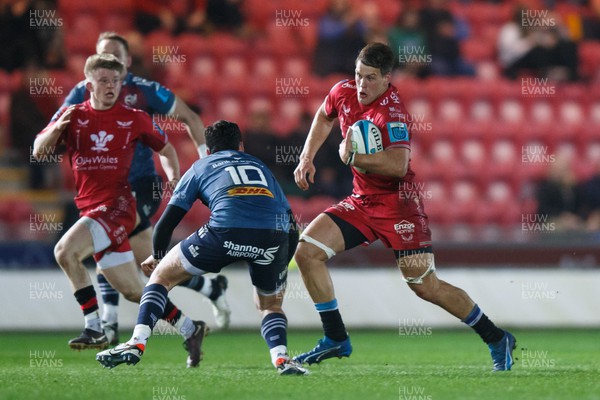 160224 - Scarlets v Munster - United Rugby Championship - Jarrod Taylor of Scarlets takes on Joey Carbery of Munster