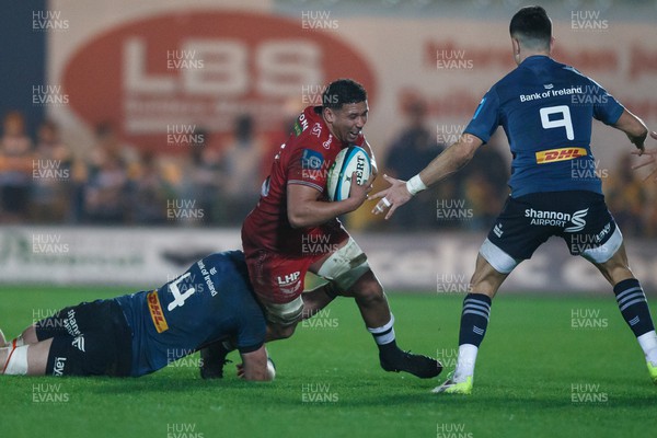 160224 - Scarlets v Munster - United Rugby Championship - Dan Davis of Scarlets is tackled by Tom Ahern of Munster