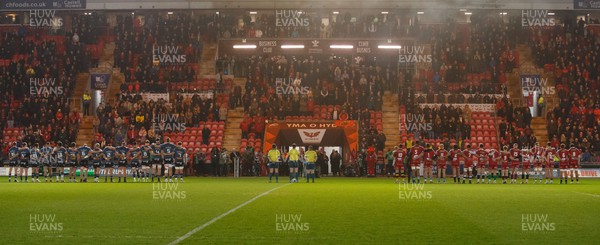 160224 - Scarlets v Munster - United Rugby Championship - Teams pay their respect to the late Barry John before the game