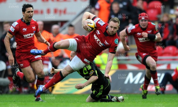 16.04.11 - Scarlets v Munster - Magners League - Morgan Stoddart of Scarlets is tackled by Peter Stringer of Munster. 