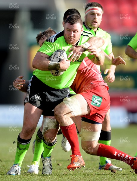 210215 - Scarlets v Munster - Guinness PRO12 -Dave Kilcoyne of Munster is tackled by John Barclay of Scarlets