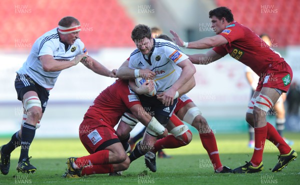 210412 - Scarlets v Munster - RaboDirect PRO12 -Donnacha Ryan of Munster is tackled by Deacon Maun of Scarlets