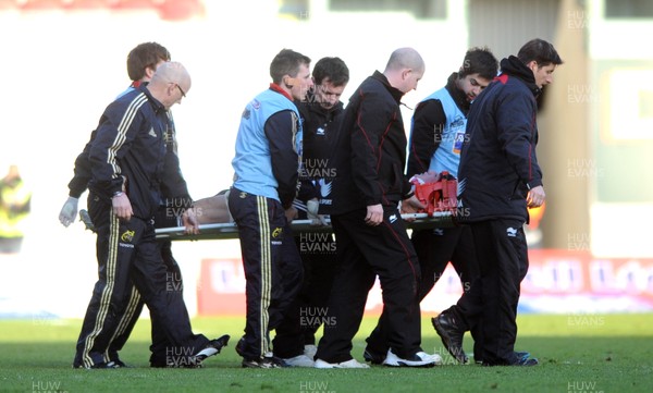 210412 - Scarlets v Munster - RaboDirect PRO12 -Tommy O'Donnell of Munster is helped off the field