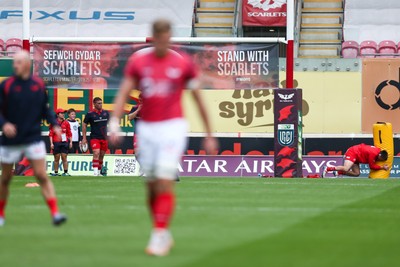 270925 - Scarlets v Munster - United Rugby Championship - Stand with Scarlets banner on the posts before the match
