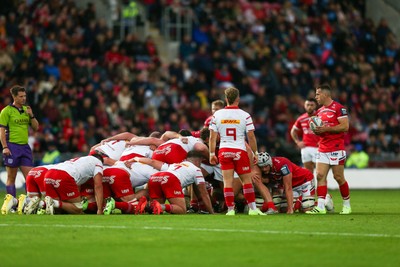 270925 - Scarlets v Munster - United Rugby Championship - Gareth Davies of Scarlets prepares to put the ball into scrum