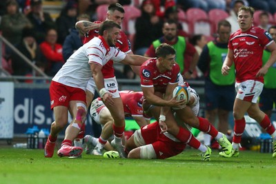 270925 - Scarlets v Munster - United Rugby Championship - Joe Hawkins of Scarlets is tackled