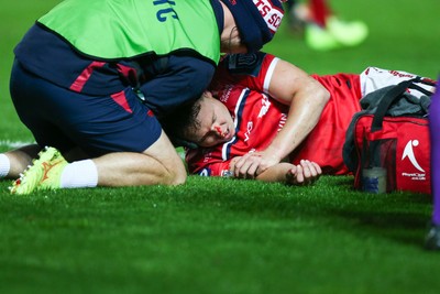 270925 - Scarlets v Munster - United Rugby Championship - Sam Costelow of Scarlets receives treatment