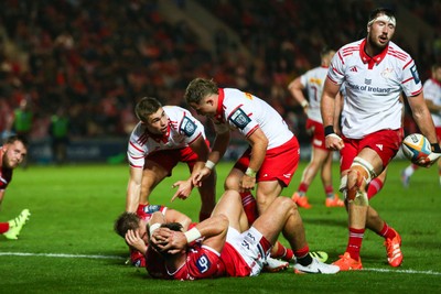 270925 - Scarlets v Munster - United Rugby Championship - Jack Crowley of Munster calls for assistance for Sam Costelow of Scarlets after he was injured in a tackle
