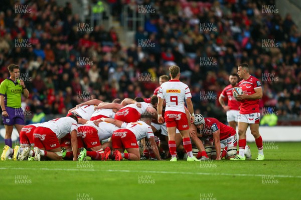 270925 - Scarlets v Munster - United Rugby Championship - Gareth Davies of Scarlets prepares to put the ball into scrum