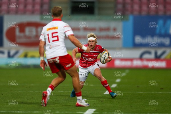 270925 - Scarlets v Munster - United Rugby Championship - Blair Murray of Scarlets takes on Mike Haley of Munster