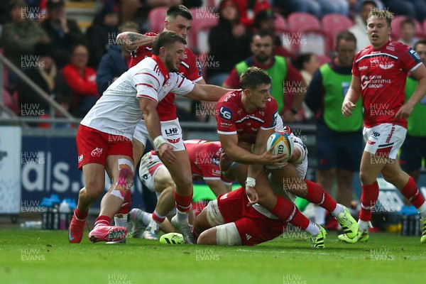 270925 - Scarlets v Munster - United Rugby Championship - Joe Hawkins of Scarlets is tackled