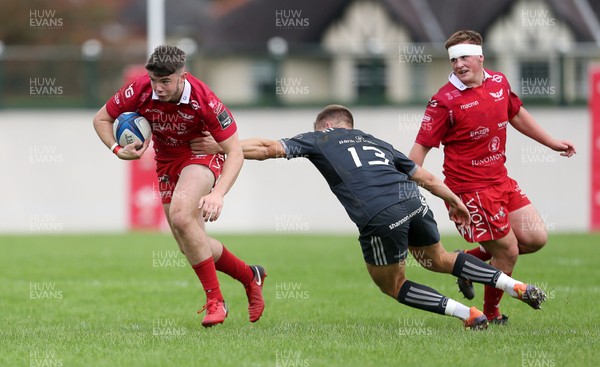 280919 - Scarlets A v Munster A - Celtic Cup - Osian Knott of Scarlets is challenged by Alex McHenry of Munster