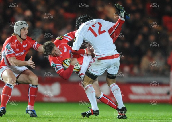 28.11.08 - Llanelli Scarlets v Munster - Magners League - Llanelli's Rhys Priestland is dumped by Lifeimi Mafi 