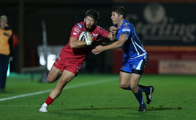 081016 - Scarlets v Newport Gwent Dragons - Guinness PRO12 - DTH van der Merwe of Scarlets is tackled by Charlie Davies of Newport Gwent Dragons